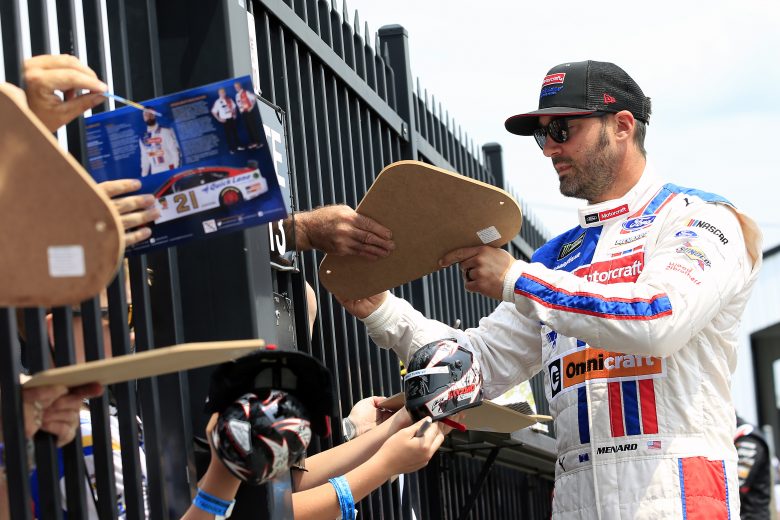 LONG POND, PENNSYLVANIA - JUNE 01: Paul Menard, driver of the #21 Motorcraft/Quick Lane Tire & Auto Center Ford, signs autographs for fans during qualifying for the Monster Energy NASCAR Cup Series Pocono 400 at Pocono Raceway on June 01, 2019 in Long Pond, Pennsylvania. (Photo by Chris Trotman/Getty Images) | Getty Images