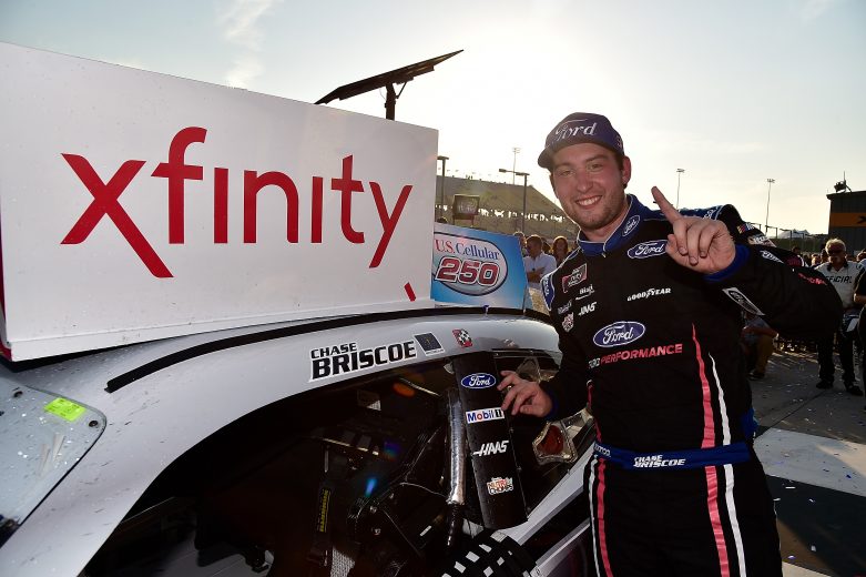 NEWTON, IA - JULY 27: Chase Briscoe, driver of the #98 Ford Performance Ford, poses with the winning sticker in victory lane after winning the NASCAR Xfinity Series U.S. Cellular 250 at Iowa Speedway on July 27, 2019 in Newton, Iowa. (Photo by Jeff Curry/Getty Images) | Getty Images