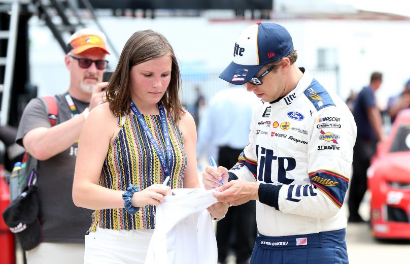 JOLIET, ILLINOIS - JUNE 29: Brad Keselowski, driver of the #2 Miller Lite Ford, signs autographs during practice for the Monster Energy NASCAR Cup Series Camping World 400 at Chicagoland Speedway on June 29, 2019 in Joliet, Illinois. (Photo by Matt Sullivan/Getty Images) | Getty Images