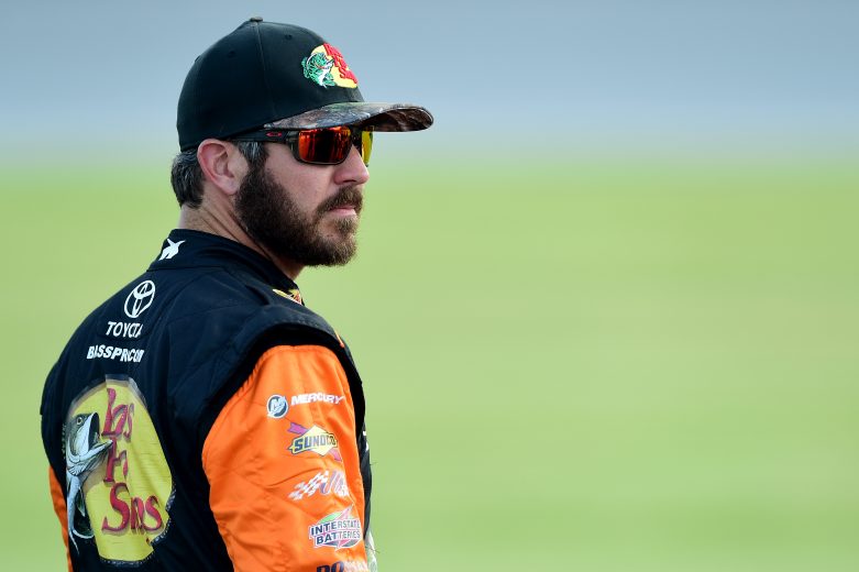 JOLIET, ILLINOIS - JUNE 29: Martin Truex Jr., driver of the #19 Bass Pro Shops Toyota, stands on the grid during qualifying for the Monster Energy NASCAR Cup Series Camping World 400 at Chicagoland Speedway on June 29, 2019 in Joliet, Illinois. (Photo by Jared C. Tilton/Getty Images) | Getty Images