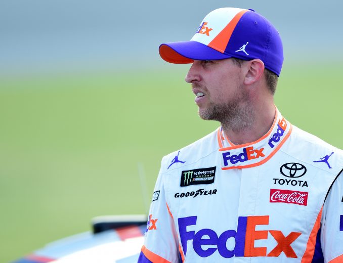 JOLIET, ILLINOIS - JUNE 29: Denny Hamlin, driver of the #11 FedEx Express Toyota, stands on the grid during qualifying for the Monster Energy NASCAR Cup Series Camping World 400 at Chicagoland Speedway on June 29, 2019 in Joliet, Illinois. (Photo by Jared C. Tilton/Getty Images) | Getty Images