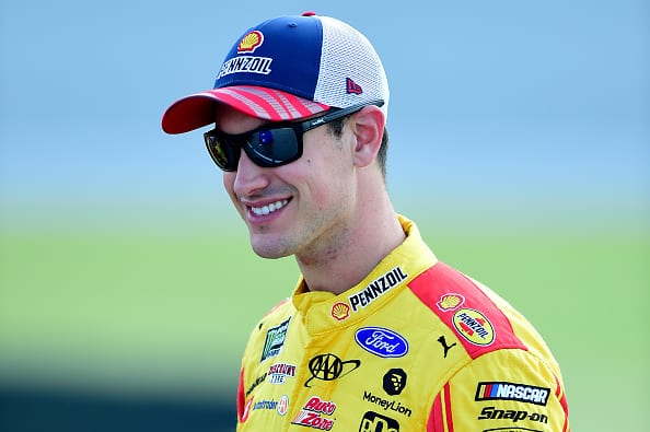 JOLIET, ILLINOIS - JUNE 29: Joey Logano, driver of the #22 Shell Pennzoil Ford, stands on the grid during qualifying for the Monster Energy NASCAR Cup Series Camping World 400 at Chicagoland Speedway on June 29, 2019 in Joliet, Illinois. (Photo by Jared C. Tilton/Getty Images) | Getty Images