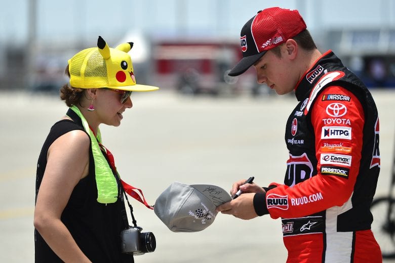 DAYTONA BEACH, FLORIDA - JULY 04: Christopher Bell, driver of the #20 Ruud-Ferguson Toyota, signs an autograph for a fan during practice for the NASCAR Xfinity Series Circle K Firecracker 250 Powered by Coca-Cola at Daytona International Speedway on July 04, 2019 in Daytona Beach, Florida. (Photo by Jeff Curry/Getty Images) | Getty Images