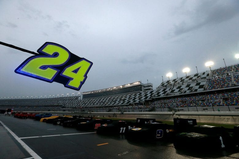 DAYTONA BEACH, FLORIDA - JULY 06: Cars sit along pit road in the rain prior to the start of the Monster Energy NASCAR Cup Series Coke Zero Sugar 400 at Daytona International Speedway on July 06, 2019 in Daytona Beach, Florida. (Photo by Sean Gardner/Getty Images) | Getty Images