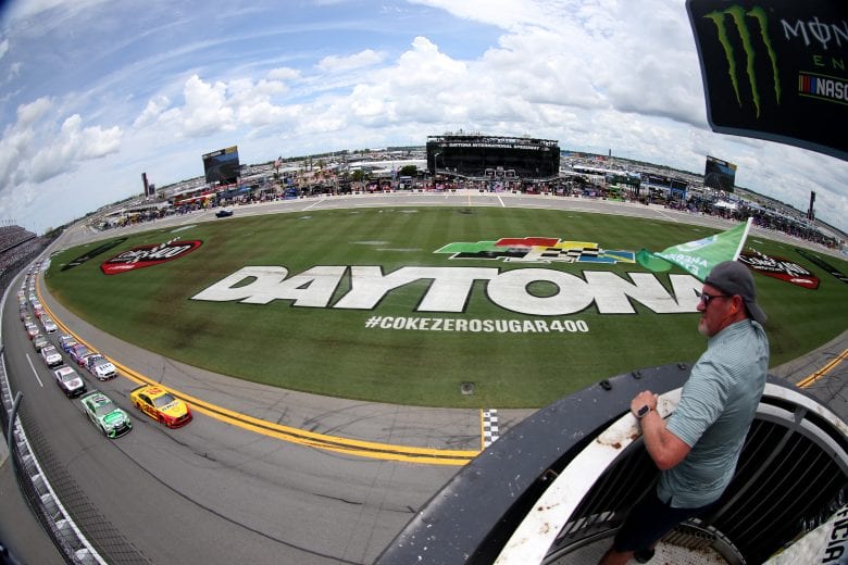 DAYTONA BEACH, FLORIDA - JULY 07: Joey Logano, driver of the #22 Shell Pennzoil Ford, and Kyle Busch, driver of the #18 Interstate Batteries Toyota, lead the field to the green flag to start the Monster Energy NASCAR Cup Series Coke Zero Sugar 400 at Daytona International Speedway on July 07, 2019 in Daytona Beach, Florida. (Photo by Matt Sullivan/Getty Images) | Getty Images