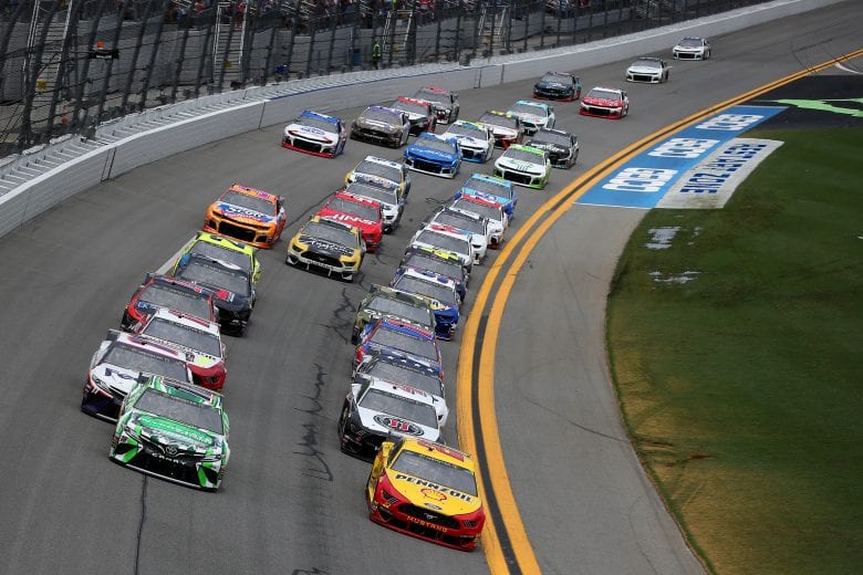 DAYTONA BEACH, FLORIDA - JULY 07: Joey Logano, driver of the #22 Shell Pennzoil Ford, and Kyle Busch, driver of the #18 Interstate Batteries Toyota, lead the field during the Monster Energy NASCAR Cup Series Coke Zero Sugar 400 at Daytona International Speedway on July 07, 2019 in Daytona Beach, Florida. (Photo by Matt Sullivan/Getty Images) | Getty Images