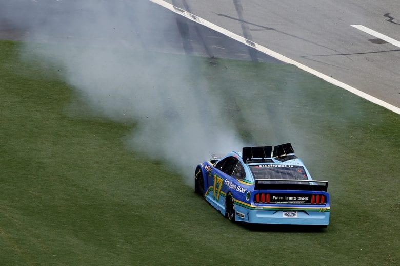 DAYTONA BEACH, FLORIDA - JULY 07: Ricky Stenhouse Jr., driver of the #17 Fifth Third Bank Ford, is involved in an on-track incident during the Monster Energy NASCAR Cup Series Coke Zero Sugar 400 at Daytona International Speedway on July 07, 2019 in Daytona Beach, Florida. (Photo by Brian Lawdermilk/Getty Images) | Getty Images