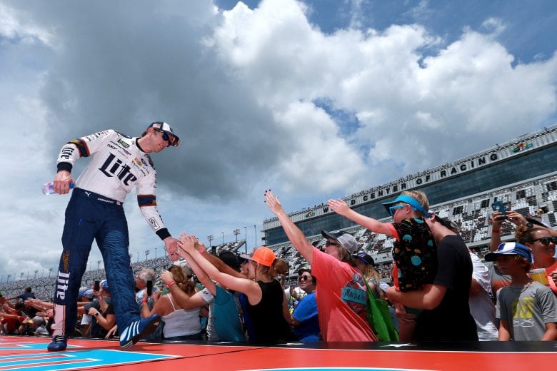 DAYTONA BEACH, FLORIDA - JULY 07: Brad Keselowski, driver of the #2 Miller Lite Ford, greets fans during pre-race ceremonies prior to the start of the Monster Energy NASCAR Cup Series Coke Zero Sugar 400 at Daytona International Speedway on July 07, 2019 in Daytona Beach, Florida. (Photo by Sean Gardner/Getty Images) | Getty Images