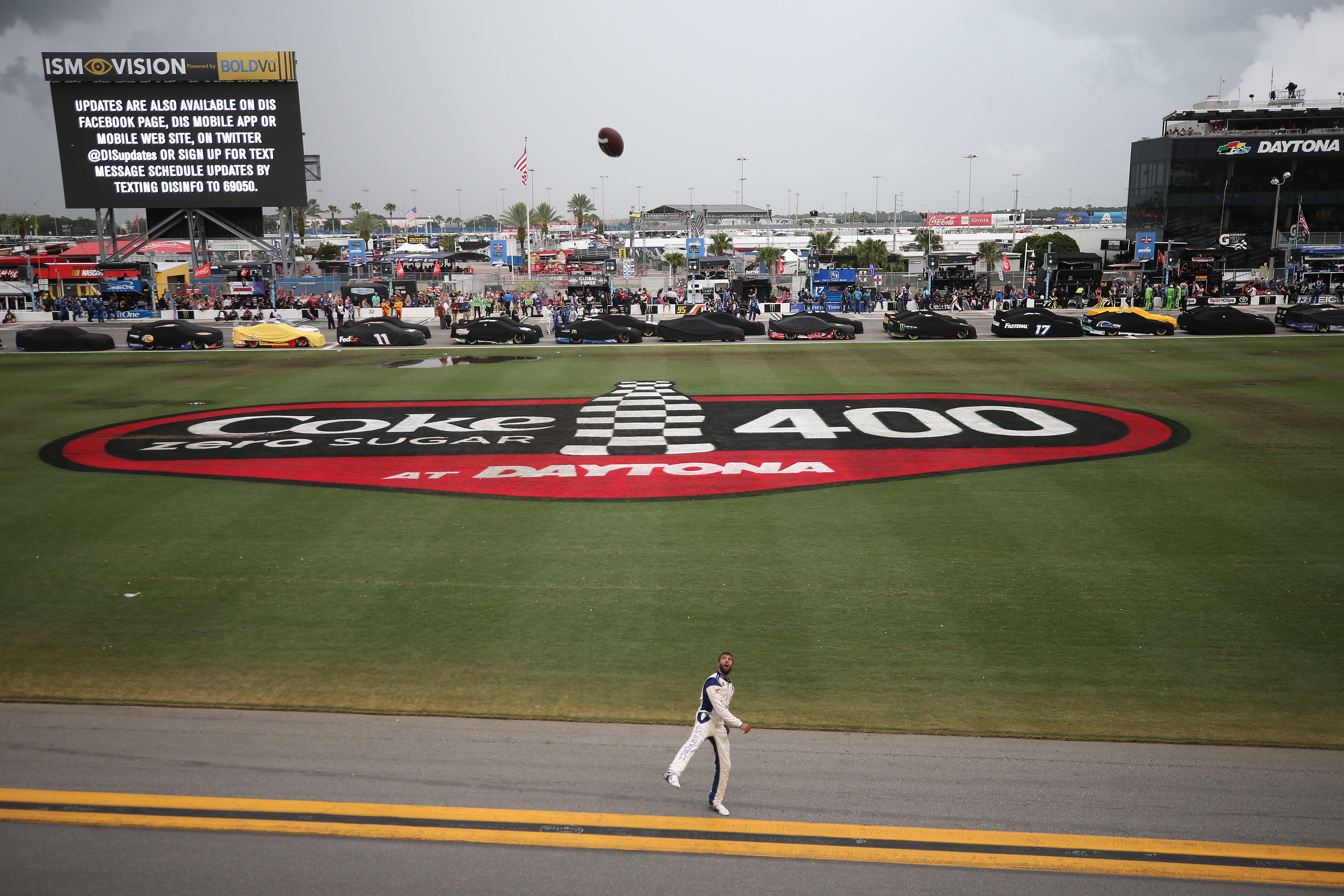 DAYTONA BEACH, FLORIDA - JULY 07: Bubba Wallace, driver of the #43 United States Air Force Chevrolet, throws a football to fans during a weather delay for the Monster Energy NASCAR Cup Series Coke Zero Sugar 400 at Daytona International Speedway on July 07, 2019 in Daytona Beach, Florida. (Photo by Matt Sullivan/Getty Images) | Getty Images