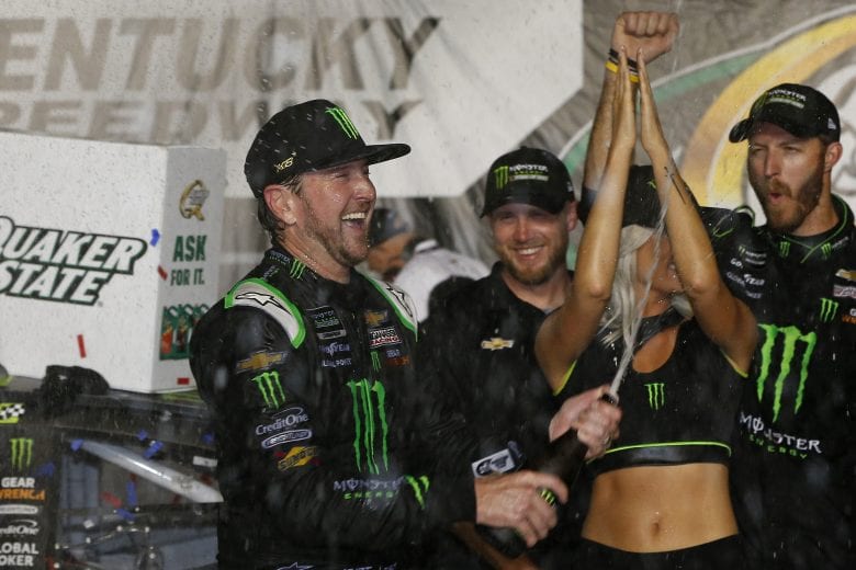 SPARTA, KENTUCKY - JULY 13: Kurt Busch, driver of the #1 Monster Energy Chevrolet, celebrates with champagne in Victory Lane after winning the Monster Energy NASCAR Cup Series Quaker State 400 Presented by Walmart at Kentucky Speedway on July 13, 2019 in Sparta, Kentucky. (Photo by Brian Lawdermilk/Getty Images) | Getty Images