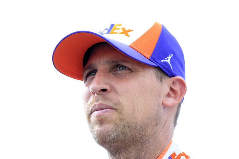 LOUDON, NEW HAMPSHIRE - JULY 19: Denny Hamlin, driver of the #11 FedEx Express Toyota, looks on during qualifying for the Monster Energy NASCAR Cup Series Foxwoods Resort Casino 301 at New Hampshire Motor Speedway on July 19, 2019 in Loudon, New Hampshire. (Photo by Chris Trotman/Getty Images) | Getty Images