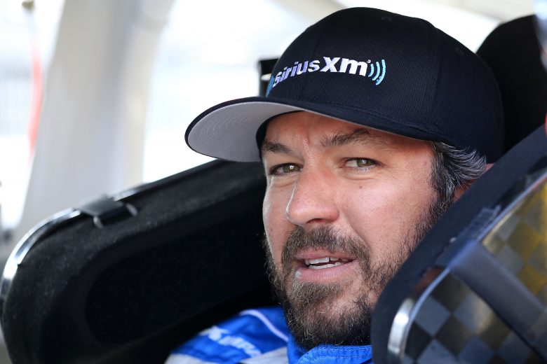 LOUDON, NEW HAMPSHIRE - JULY 19: Martin Truex Jr, driver of the #19 Sirius XM ToyotKurt Busch, driver of the #1 Monster Energy Chevrolet, sits in his car during qualifying for the Monster Energy NASCAR Cup Series Foxwoods Resort Casino 301 at New Hampshire Motor Speedway on July 19, 2019 in Loudon, New Hampshire. (Photo by Chris Trotman/Getty Images) | Getty Images