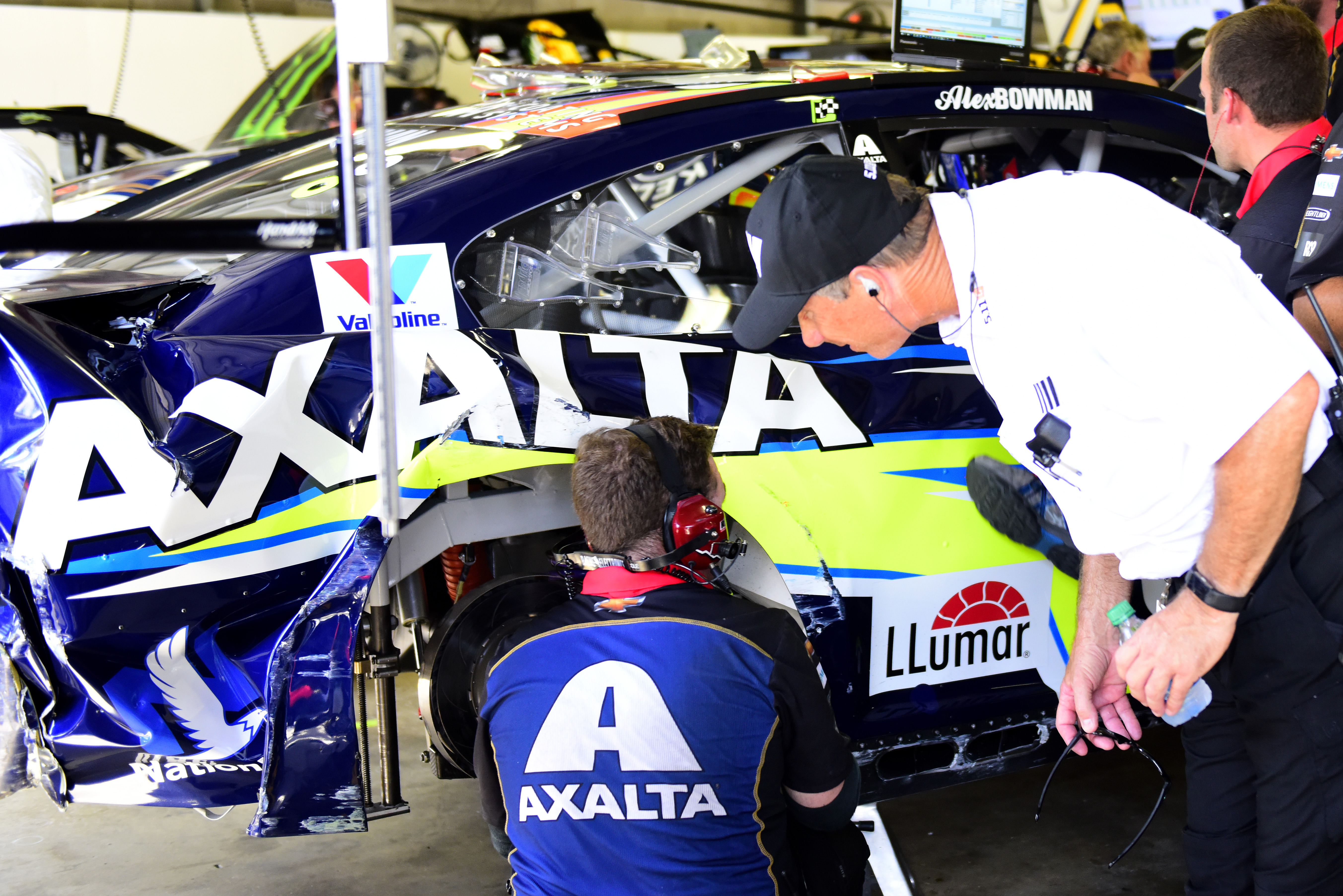LOUDON, NEW HAMPSHIRE - JULY 20: A crew member for Alex Bowman, driver of the #88 Axalta Chevrolet, and a NASCAR official look over the damage following an on-track incident during practice for the Monster Energy NASCAR Cup Series Foxwoods Resort Casino 301 at New Hampshire Motor Speedway on July 20, 2019 in Loudon, New Hampshire. (Photo by Jared C. Tilton/Getty Images) | Getty Images