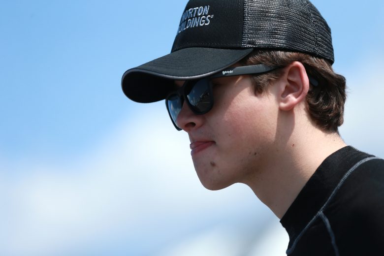 LONG POND, PENNSYLVANIA - JULY 26: Harrison Burton, driver of the #18 Morton Buildings Toyota, walks through the garage area during practice for the NASCAR Gander Outdoors Truck Series Gander RV 150 at Pocono Raceway on July 26, 2019 in Long Pond, Pennsylvania. (Photo by Sean Gardner/Getty Images) | Getty Images