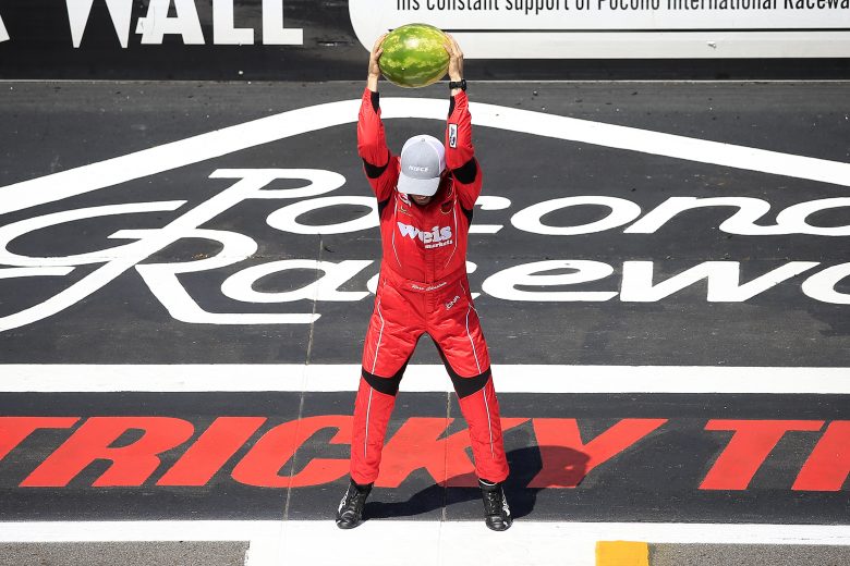 LONG POND, PENNSYLVANIA - JULY 27: Ross Chastain, driver of the #45 Niece/Acurlite Chevrolet, celebrates by smashing a watermelon following his victory in the NASCAR Gander Outdoors Truck Series Gander RV 150 at Pocono Raceway on July 27, 2019 in Long Pond, Pennsylvania. (Photo by Chris Trotman/Getty Images) | Getty Images