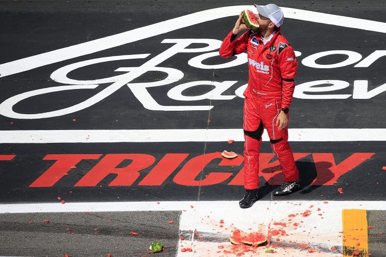 LONG POND, PENNSYLVANIA - JULY 27: Ross Chastain, driver of the #45 Niece/Acurlite Chevrolet, celebrates by eating a watermelon following his victory in the NASCAR Gander Outdoors Truck Series Gander RV 150 at Pocono Raceway on July 27, 2019 in Long Pond, Pennsylvania. (Photo by Chris Trotman/Getty Images) | Getty Images
