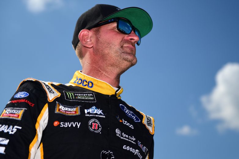 LONG POND, PENNSYLVANIA - JULY 27: Clint Bowyer, driver of the #14 Toco Warranty/Haas Automation Ford, walks on the grid during qualifying for the Monster Energy NASCAR Cup Series Gander RV 400 at Pocono Raceway on July 27, 2019 in Long Pond, Pennsylvania. (Photo by Jared C. Tilton/Getty Images) | Getty Images
