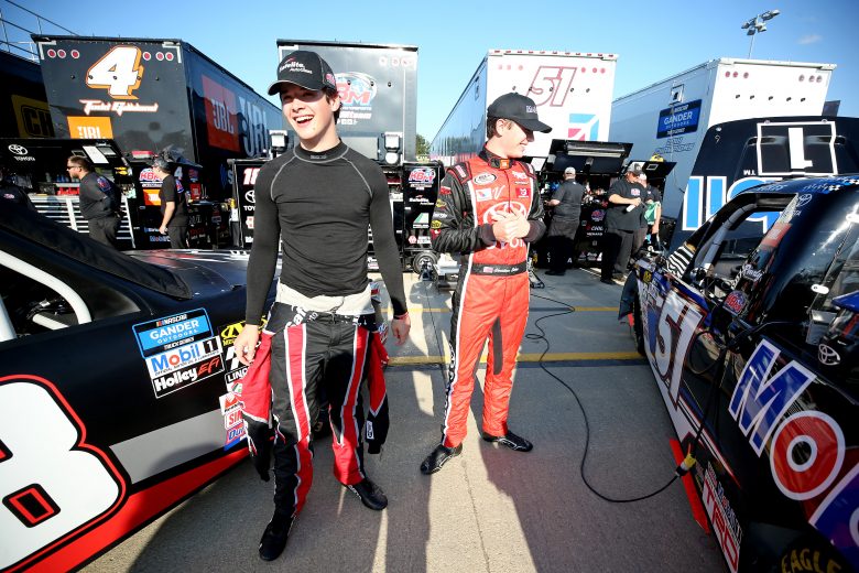 ROSSBURG, OHIO - JULY 31: Harrison Burton, driver of the #18 Safelite AutoGlass Toyota, and Christian Eckes, driver of the #51 Mobil 1 Toyota, talk during practice for the NASCAR Gander Outdoor Truck Series Eldora Dirt Derby at Eldora Speedway on July 31, 2019 in Rossburg, Ohio. (Photo by Matt Sullivan/Getty Images) | Getty Images