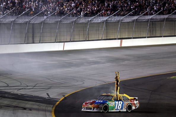 SPARTA, KY - JULY 09: Kyle Busch, driver of the #18 M&M's Toyota, celebrates after winning the NASCAR Sprint Cup Series Quaker State 400 at Kentucky Speedway on July 9, 2011 in Sparta, Kentucky. (Photo by Andy Lyons/Getty Images for NASCAR) | Getty Images