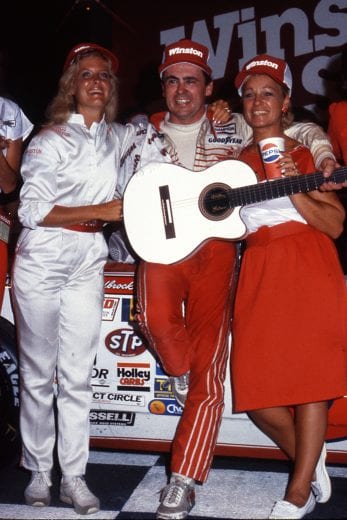 NASHVILLE, TN — July 14, 1984:  Geoff Bodine displays the guitar he won for taking the checkered flag first in the Pepsi 420 NASCAR Cup race at Nashville Speedway.  Bodine, driving Rick Hendrick’s Northwestern Security Life Chevrolet, led 327 of the 420 laps on his way to the win.  (Photo by ISC Images & Archives via Getty Images)