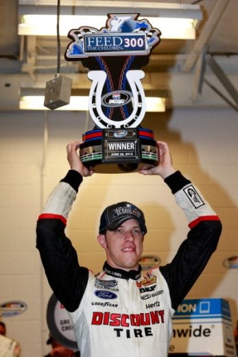 SPARTA, KY - JUNE 28: Brad Keselowski, driver of the #22 Discount Tire Ford, celebrates in victory lane after winning the rain-shortened NASCAR Nationwide Series Feed The Children 300 at Kentucky Speedway on June 28, 2013 in Sparta, Kentucky. (Photo by Chris Trotman/Getty Images) | Getty Images