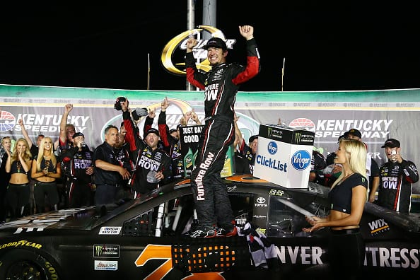 SPARTA, KENTUCKY - JULY 08: Martin Truex Jr., driver of the #78 Furniture Row/Denver Mattress Toyota, celebrates in Victory Lane after winning the Monster Energy NASCAR Cup Series Quaker State 400 presented by Advance Auto Parts at Kentucky Speedway on July 8, 2017 in Sparta, Kentucky. (Photo by Sarah Crabill/Getty Images) | Getty Images