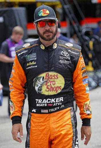 JOLIET, ILLINOIS - JUNE 29: Martin Truex Jr., driver of the #19 Bass Pro Shops Toyota, walks to his car before practice for the Monster Energy NASCAR Cup Series Camping World 400 at Chicagoland Speedway on June 29, 2019 in Joliet, Illinois. (Photo by Jonathan Daniel/Getty Images) | Getty Images