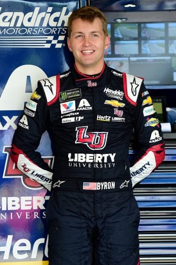JOLIET, ILLINOIS - JUNE 29: William Byron, driver of the #24 Liberty University Chevrolet, stands in the garage area during practice for the Monster Energy NASCAR Cup Series Camping World 400 at Chicagoland Speedway on June 29, 2019 in Joliet, Illinois. (Photo by Jared C. Tilton/Getty Images) | Getty Images