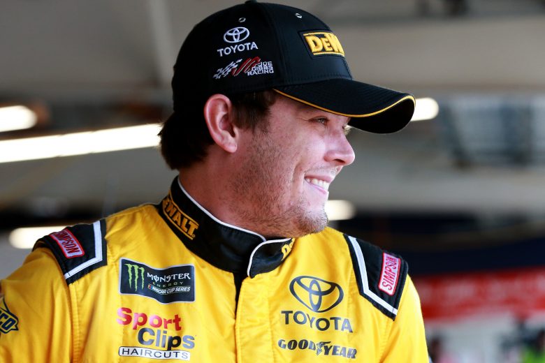 WATKINS GLEN, NEW YORK - AUGUST 03: Erik Jones, driver of the #20 DeWalt Toyota, stands in the garage during practice for the Monster Energy NASCAR Cup Series Go Bowling at The Glen at Watkins Glen International on August 03, 2019 in Watkins Glen, New York. (Photo by Sean Gardner/Getty Images) | Getty Images