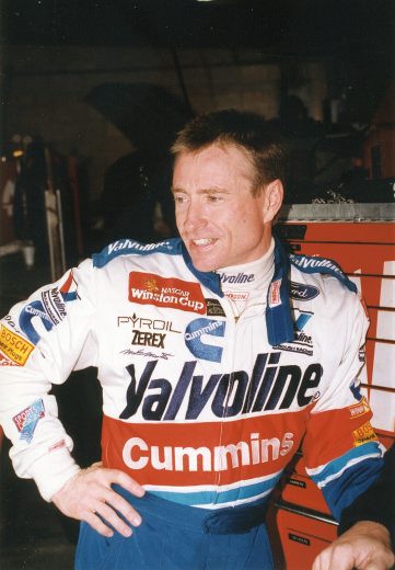 1996:  Mark Martin driver of the #6 Valvoline Ford stands in the garage before a race circa 1996.  (Photo by ISC Archives/CQ-Roll Call Group via Getty Images)