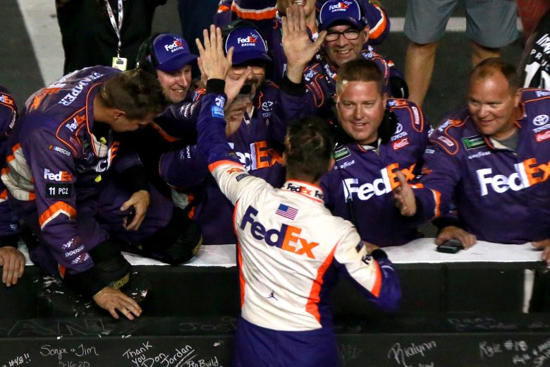 BRISTOL, TENNESSEE - AUGUST 17: Denny Hamlin, driver of the #11 FedEx Freight Toyota, celebrates with his team after winning the Monster Energy NASCAR Cup Series Bass Pro Shops NRA Night Race at Bristol Motor Speedway on August 17, 2019 in Bristol, Tennessee. (Photo by Sean Gardner/Getty Images) | Getty Images