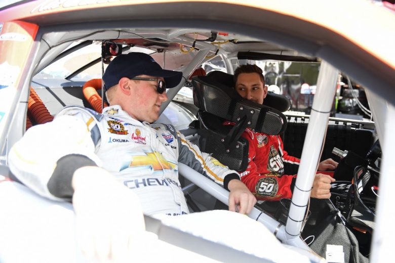 ELKHART LAKE, WISCONSIN - AUGUST 23:  Tyler Reddick, driver of the #2 Roland Chevrolet, sits in the car of Kaz Grala, driver of the #21 HotScream Chevrolet, during practice for the NASCAR Xfinity Series CTECH Manufacturing 180 at Road America on August 23, 2019 in Elkhart Lake, Wisconsin. (Photo by Stacy Revere/Getty Images) | Getty Images