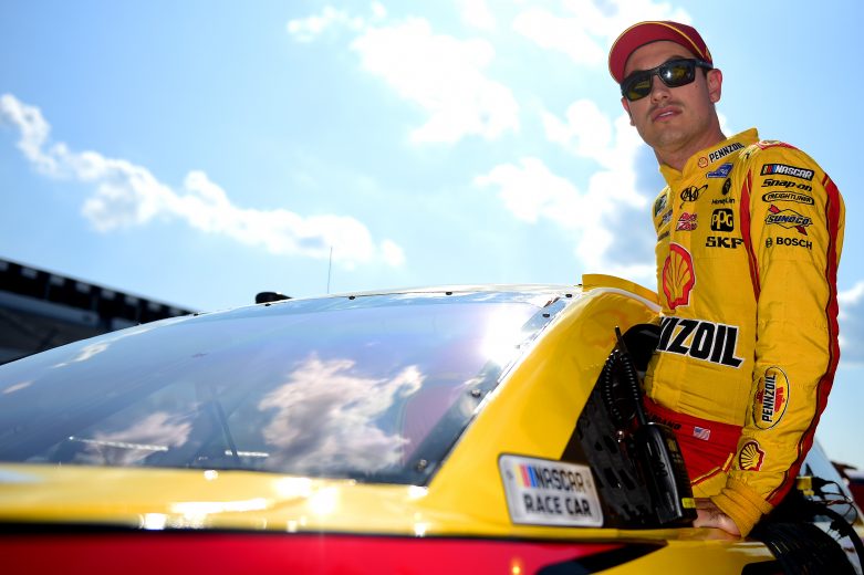 LONG POND, PENNSYLVANIA - JULY 27: Joey Logano, driver of the #22 Shell Pennzoil Ford, climbs into his car during qualifying for the Monster Energy NASCAR Cup Series Gander RV 400 at Pocono Raceway on July 27, 2019 in Long Pond, Pennsylvania. (Photo by Jared C. Tilton/Getty Images) | Getty Images