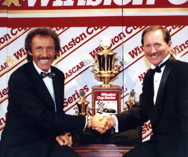 NEW YORK - DECEMBER 2:  Seven time Winston cup Champion Richard Petty congratulates Dale Earnhardt on his seventh championship during the annual Awards Banquet on December 2, 1994 in New York City, New York. (Photo by Dozier Mobley/Getty Images)