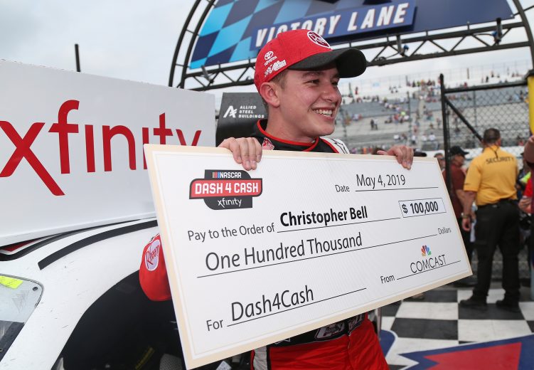 DOVER, DE - MAY 04: Christopher Bell, driver of the #20 Rheem Toyota, poses with a check after winning the Dash 4 Cash and the NASCAR Xfinity Series Allied Steel Buildings 200 at Dover International Speedway on May 4, 2019 in Dover, Delaware. (Photo by Matt Sullivan/Getty Images) | Getty Images