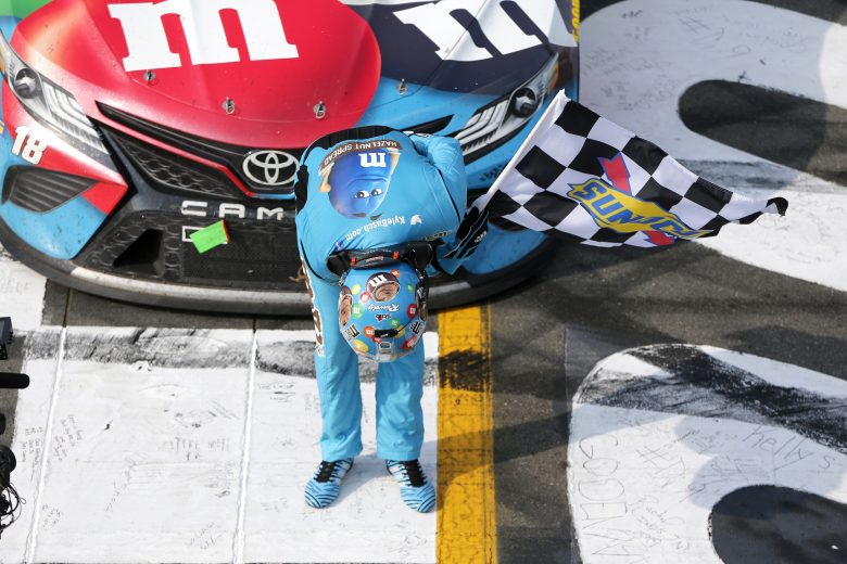 LONG POND, PENNSYLVANIA - JUNE 02: Kyle Busch, driver of the #18 M&M's Hazelnut Toyota, celebrates winning the Monster Energy NASCAR Cup Series Pocono 400 at Pocono Raceway on June 02, 2019 in Long Pond, Pennsylvania. (Photo by Jonathan Ferrey/Getty Images) | Getty Images