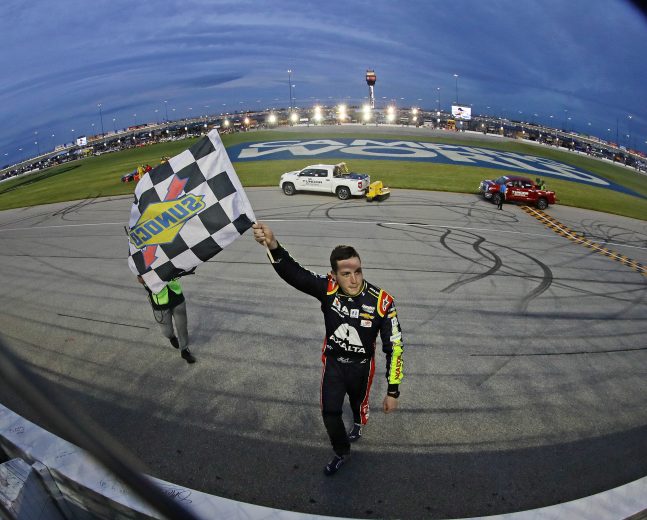 JOLIET, ILLINOIS - JUNE 30: Alex Bowman, driver of the #88 Axalta Chevrolet, waves the checkered flag after winning the Monster Energy NASCAR Cup Series Camping World 400 at Chicagoland Speedway on June 30, 2019 in Joliet, Illinois. (Photo by Jonathan Daniel/Getty Images) | Getty Images
