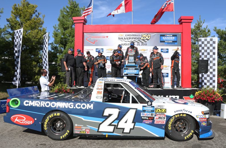 BOWMANVILLE, ON - AUGUST 25:  Brett Moffitt #24 driving the CMR Construction & Roofing Chevrolet celebrates victory of the Chevrolet Silverado 250 Gander Nascar Outdoor Truck Series event at Canadian Tire Motorsport Park on August 25, 2019 in Bowmanville, Ontario, Canada. (Photo by Claus Andersen/Getty Images) | Getty Images