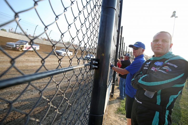 ROSSBURG, OHIO - AUGUST 01: Johnny Sauter, driver of the #13 Tenda Heal Ford, watches a qualifying race for the NASCAR Gander Outdoor Truck Series Eldora Dirt Derby at Eldora Speedway on August 01, 2019 in Rossburg, Ohio. (Photo by Matt Sullivan/Getty Images) | Getty Images