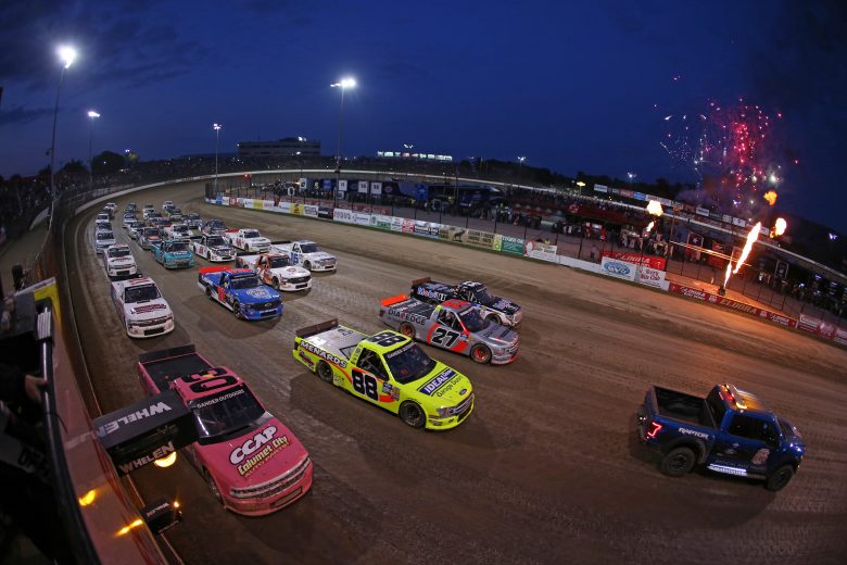 ROSSBURG, OHIO - AUGUST 01: The field does a four-wide military salute prior to the start of the NASCAR Gander Outdoor Truck Series Eldora Dirt Derby at Eldora Speedway on August 01, 2019 in Rossburg, Ohio. (Photo by Matt Sullivan/Getty Images) | Getty Images