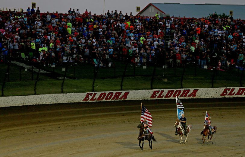 ROSSBURG, OHIO - AUGUST 01: Fans salute during the national anthem prior to the start of the NASCAR Gander Outdoor Truck Series Eldora Dirt Derby at Eldora Speedway on August 01, 2019 in Rossburg, Ohio. (Photo by Matt Sullivan/Getty Images) | Getty Images