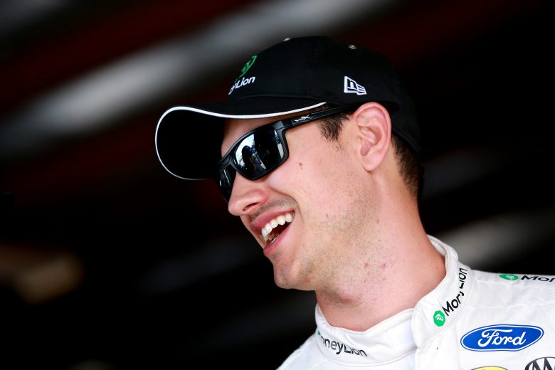 WATKINS GLEN, NEW YORK - AUGUST 03: Joey Logano, driver of the #22 MoneyLion Ford, stands in the garage area during practice for the Monster Energy NASCAR Cup Series Go Bowling at The Glen at Watkins Glen International on August 03, 2019 in Watkins Glen, New York. (Photo by Sean Gardner/Getty Images) | Getty Images