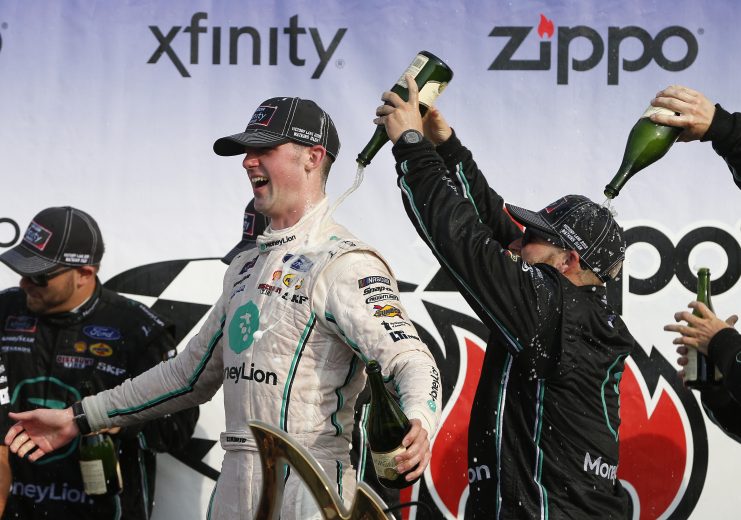 WATKINS GLEN, NEW YORK - AUGUST 03: Austin Cindric, driver of the #22 MoneyLion Ford, celebrates in Victory Lane after winning the NASCAR Xfinity Series Zippo 200 at The Glen at Watkins Glen International on August 03, 2019 in Watkins Glen, New York. (Photo by Brian Lawdermilk/Getty Images) | Getty Images