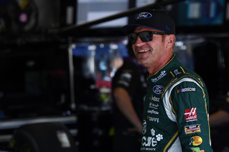 BROOKLYN, MICHIGAN - AUGUST 10: Clint Bowyer, driver of the #14 One Cure Ford, stands by his car during practice for the Monster Energy NASCAR Cup Series Consumers Energy 400 at Michigan International Speedway on August 10, 2019 in Brooklyn, Michigan. (Photo by Stacy Revere/Getty Images) | Getty Images