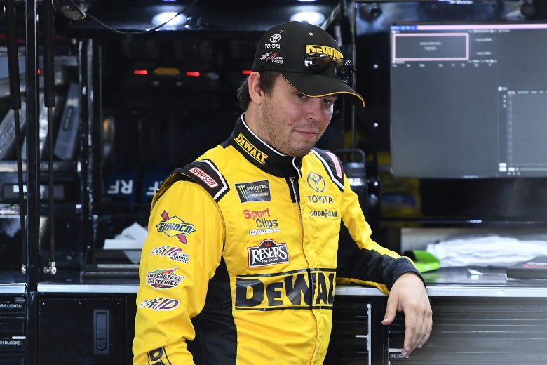 BROOKLYN, MICHIGAN - AUGUST 10: Erik Jones, driver of the #20 DeWalt Toyota, stands by his car during practice for the Monster Energy NASCAR Cup Series Consumers Energy 400 at Michigan International Speedway on August 10, 2019 in Brooklyn, Michigan. (Photo by Stacy Revere/Getty Images) | Getty Images