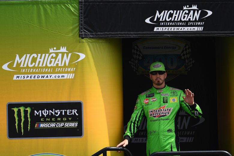 BROOKLYN, MICHIGAN - AUGUST 11: Kyle Busch, driver of the #18 Interstate Batteries Toyota, greets the crowd at driver introductions during the Monster Energy NASCAR Cup Series Consumers Energy 400 at Michigan International Speedway on August 11, 2019 in Brooklyn, Michigan. (Photo by Stacy Revere/Getty Images) | Getty Images
