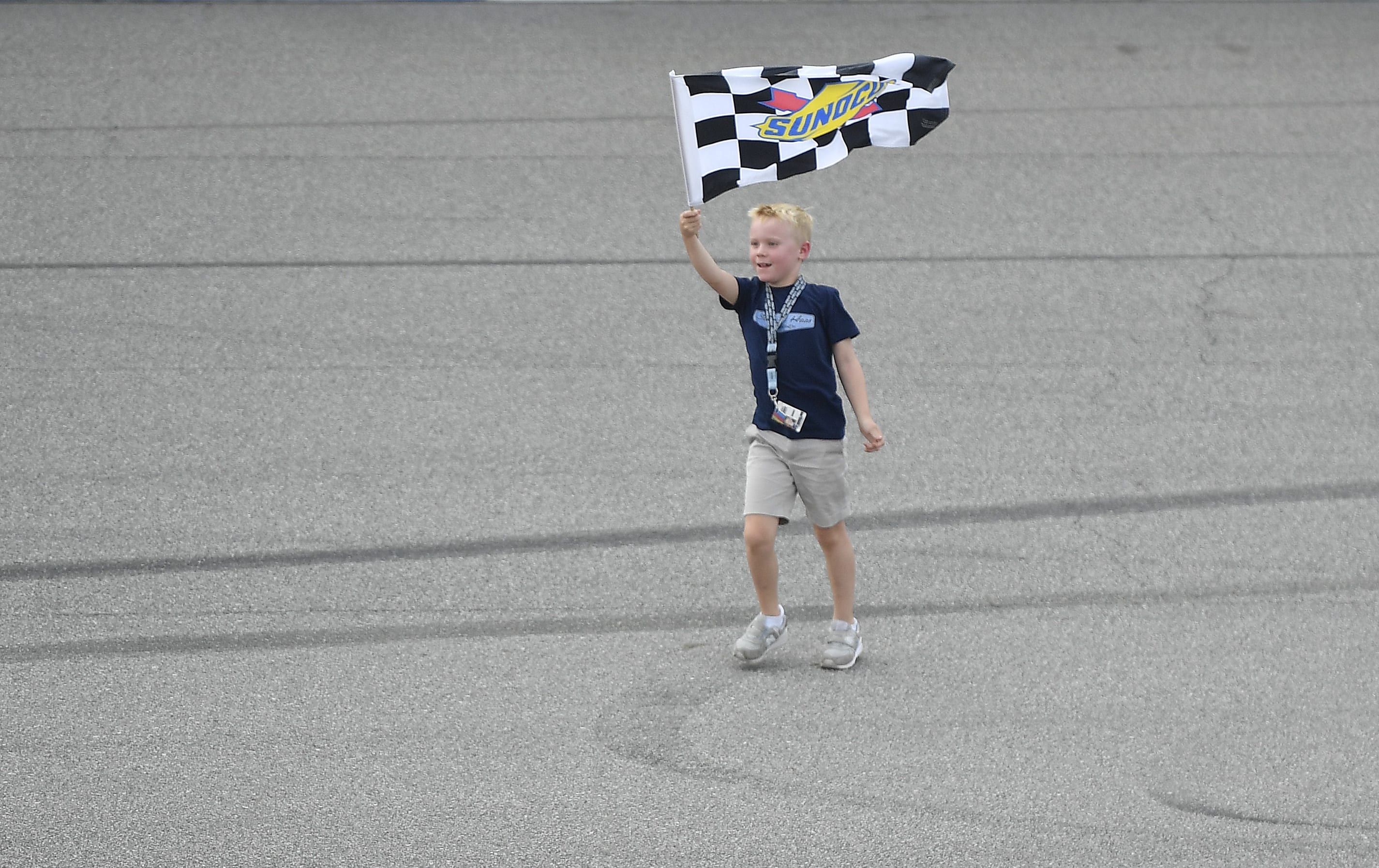 BROOKLYN, MICHIGAN - AUGUST 11: Kevin Harvick, driver of the #4 Mobil 1 Ford, has his son, Keelan, celebrate with the checkered flag after winning the Monster Energy NASCAR Cup Series Consumers Energy 400 at Michigan International Speedway on August 11, 2019 in Brooklyn, Michigan. (Photo by Quinn Harris/Getty Images) | Getty Images