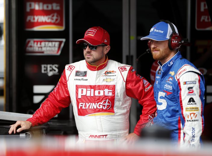 BRISTOL, TENNESSEE - AUGUST 15: Michael Annett, driver of the #1 Pilot Flying J Chevrolet, talks with Jeb Burton, driver of the #8 LS Tractor Chevrolet, during practice for the NASCAR Xfinity Series Food City 300 at Bristol Motor Speedway on August 15, 2019 in Bristol, Tennessee. (Photo by Brian Lawdermilk/Getty Images) | Getty Images