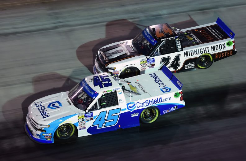 BRISTOL, TENNESSEE - AUGUST 15: Ross Chastain, driver of the #45 CarShield Chevrolet, and Brett Moffitt, driver of the #24 Midnight Moon Moonshine Chevrolet, race during the NASCAR Gander Outdoor Truck Series UNOH 200 presented by Ohio Logistics at Bristol Motor Speedway on August 15, 2019 in Bristol, Tennessee. (Photo by Jared C. Tilton/Getty Images) | Getty Images