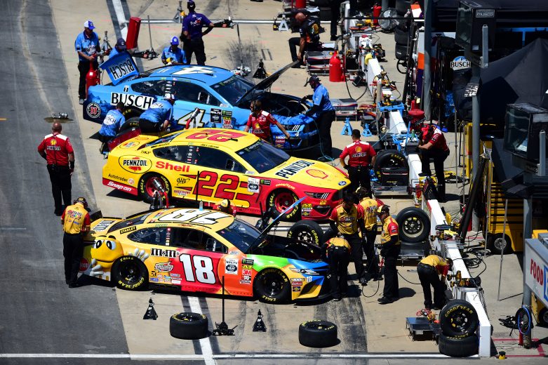 BRISTOL, TENNESSEE - AUGUST 16: Crew members for Kyle Busch, driver of the #18 M&M's Toyota, Joey Logano, driver of the #22 Shell Pennzoil Ford, and Kevin Harvick, driver of the #4 Busch Beer Ford, make adjustments during practice for the Monster Energy NASCAR Cup Series Bass Pro Shops NRA Night Race at Bristol Motor Speedway on August 16, 2019 in Bristol, Tennessee. (Photo by Jared C. Tilton/Getty Images) | Getty Images